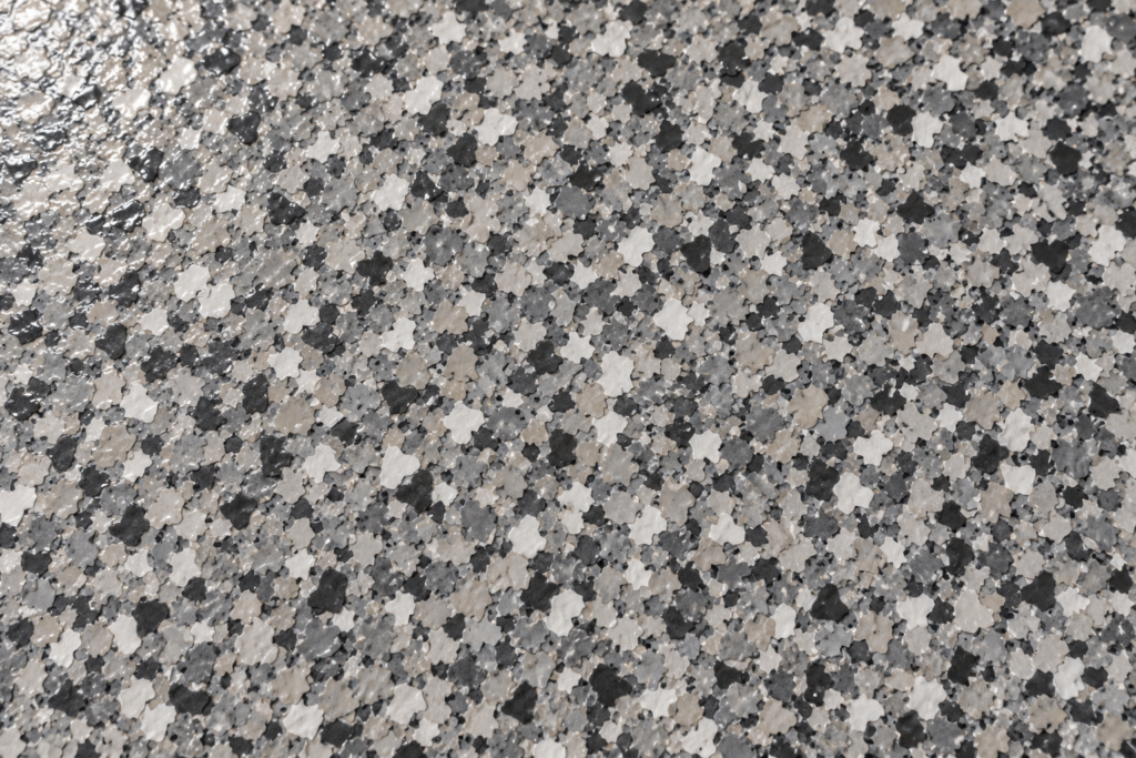 Close-up of full broadcast decorative flake texture embedded in a clear topcoat